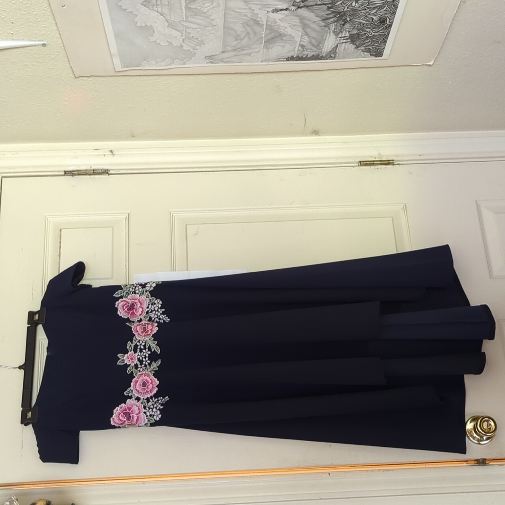 Premier Amour, 8, dark blue off the shoulder with pink flower embroidery.